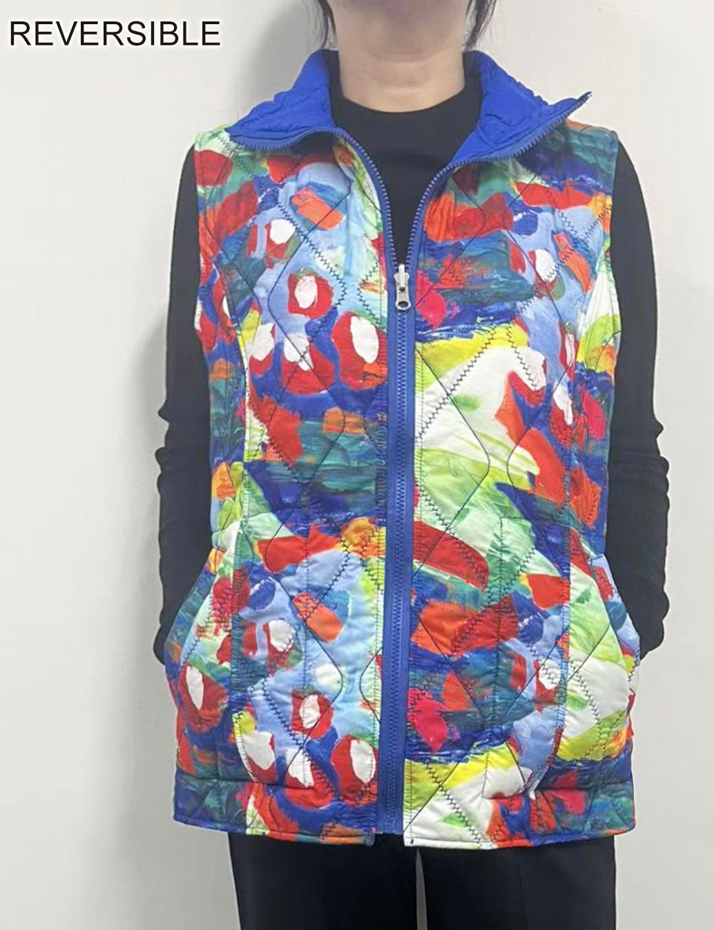 Reversible Puffer Vest with a Zip Up Front and Slash Pockets