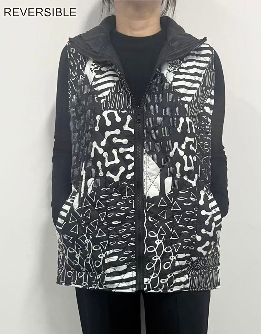 Reversible Puffer Vest with a Zip Up Front and Slash Pockets